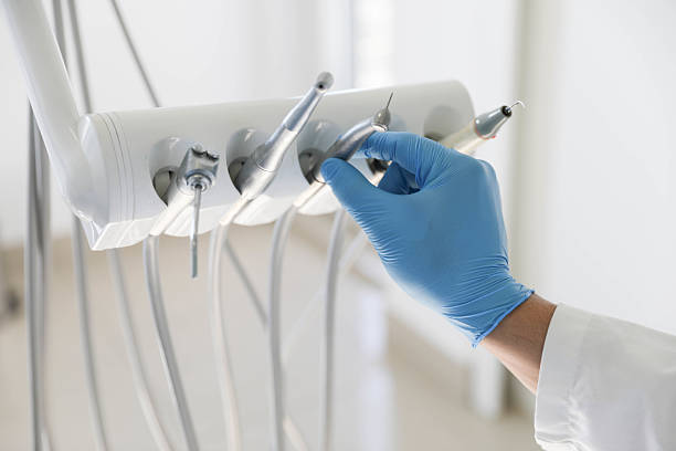 Professional Tooth Extraction technician working in Farmingdale, NJ